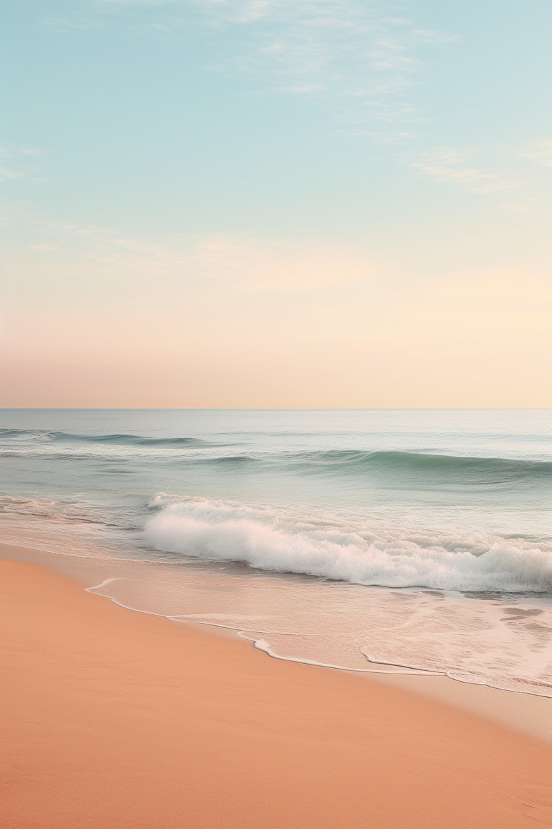 Serene beach with pastel colors and gentle waves at sunset